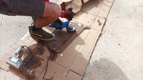 Boy remove rust from a piece of metal with a grinder, 4k time lapse Stock Footage 170673186