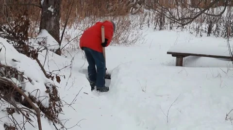 Boy removes snow Stock Footage 45861742