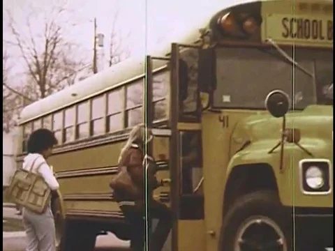 A boy is reprimanded by the school bus driver when he tries to enter the bus by Stock Footage 75410877