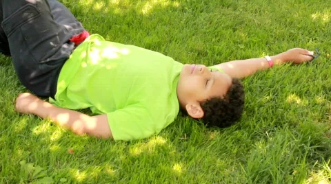 Boy resting in shade (HD) k Stock Footage 734869