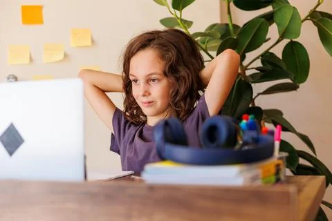 Boy resting sitting in front of a laptop. boy at school. Stock Photos