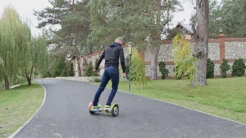 Boy ride on a Segway Stock Footage 69112425