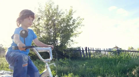 Boy rides a bicycle Video stock 46842313