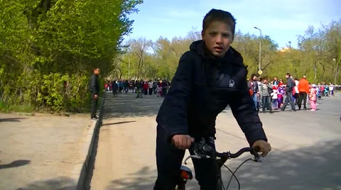 A boy rides a bicycle Stock Footage 62926441