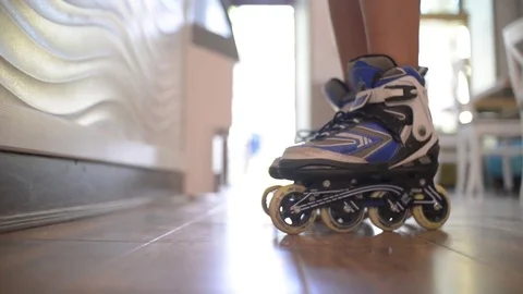 The Boy rides on rollers inside an Ice cream Shop Stock Footage 80086613