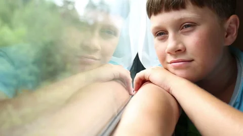 The boy rides in a train Stock Footage 52938006