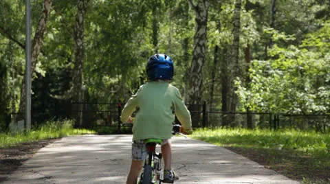 Boy riding a bicycle Stock Footage 25672177