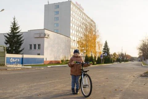 Boy is riding a bicycle Stock Photos