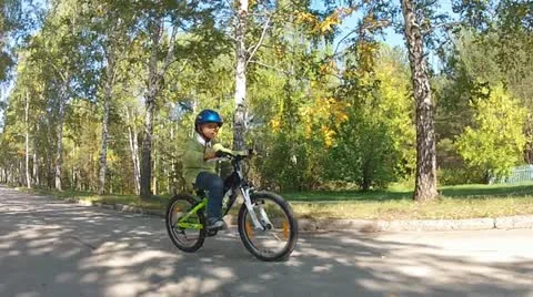 Boy riding a bike Stock Footage 12487727