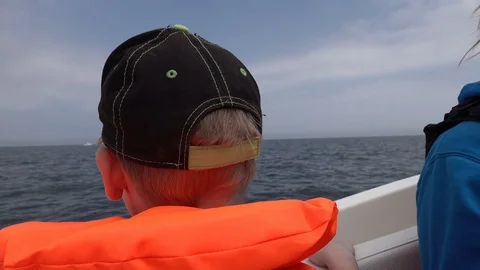 Boy riding in a boat Stock Footage 91285339
