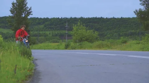 Boy Riding Motor Scooter On Road Stock Footage 63394598