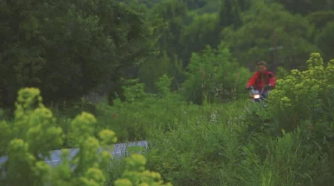 Boy Riding Motor Scooter On Road Stock Footage 63394635