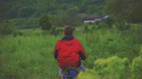 Boy Riding Motor Scooter On Road Stock Footage 63394650