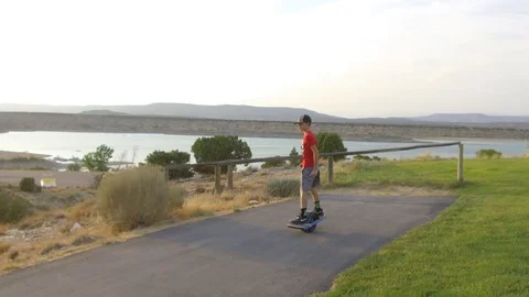 Boy Riding OneWheel Stock Footage 97651069