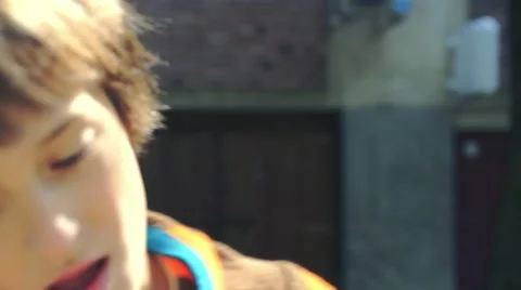 Boy riding scooter Stock Footage 63401779