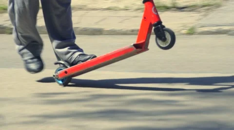 Boy riding scooter Stock Footage 63404444