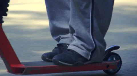 Boy riding scooter Stock Footage 63405026