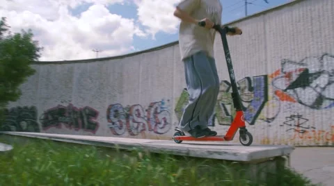 Boy riding scooter Stock Footage 63426338