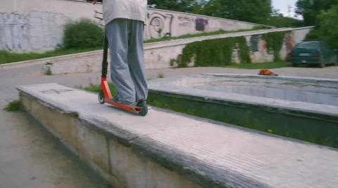 Boy riding scooter Stock Footage 63427649