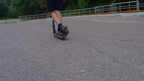 Boy riding a scooter Stock Footage 249905571