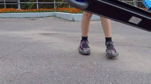 Boy  riding a scooter Stock Footage 249905621
