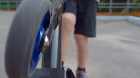 Boy riding a scooter Stock Footage 249905624