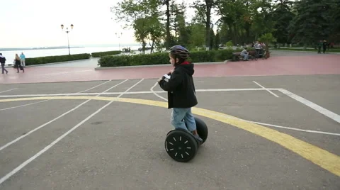 Boy riding on a Segway Stock Footage 40742919