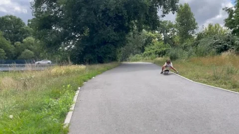 Boy riding a skateboard down the mountain Stock Footage 247447967