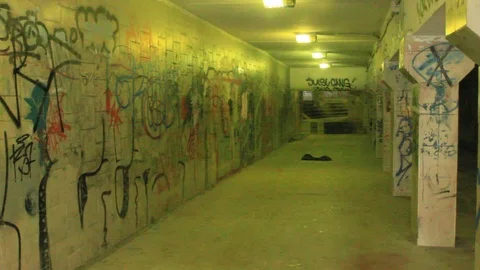 Boy riding a skateboard in the underpass Stock Footage 87126604
