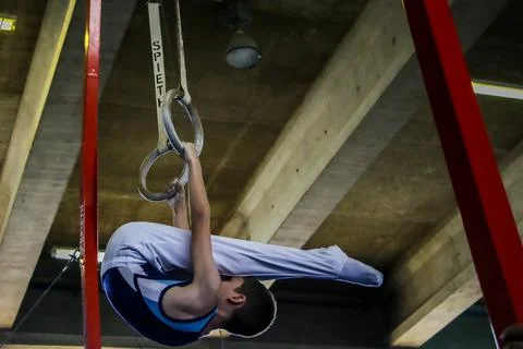 Boy on rings Stock Photos
