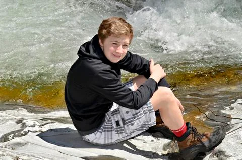 Boy at the river Stock Photos