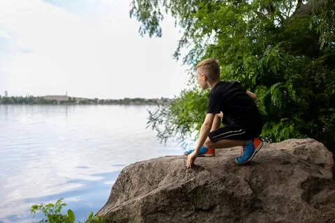 Boy by the river Stock Photos