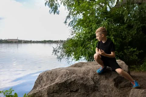 Boy by the river Stock Photos