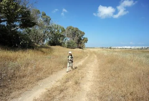 The boy on the road Stock Photos