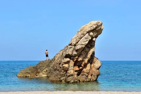 Boy on rock 스톡 사진