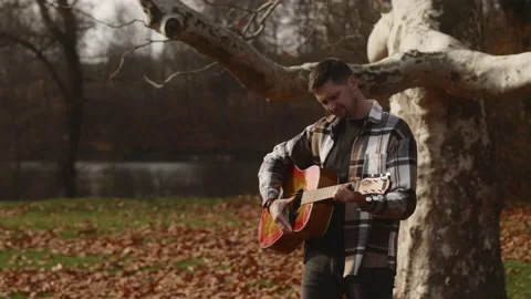 A boy rocker plays the guitar Video stock 233329850