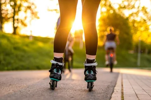 Boy Roller Skating At Sunset Stock Photos