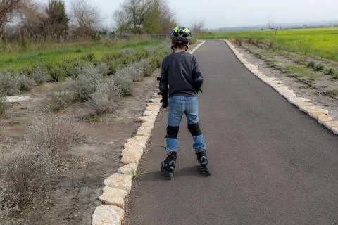 Boy rollerblading in the park Stock Photos
