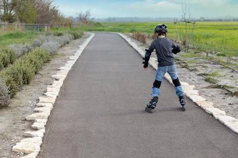 Boy rollerblading in the park Stock Photos