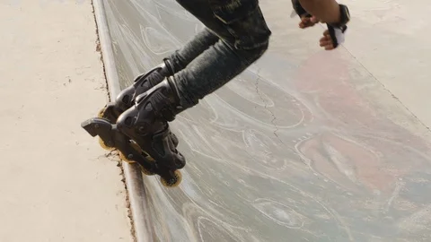 Boy rollerblading on the ramp in slow motion. Stock Footage 110808652