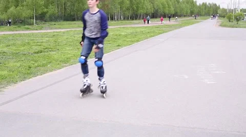 Boy Rollerblading On The Road Video stock 52318915