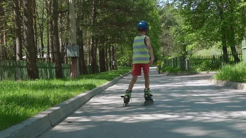 Boy rollerblading in sunny day. Stock Footage 91018388