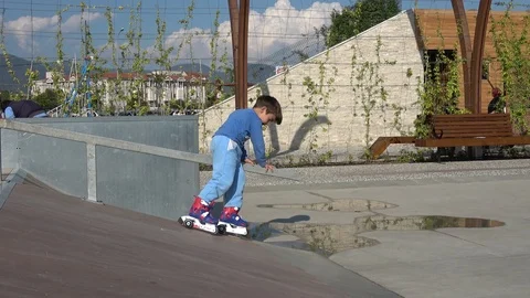 Boy in rollers painfully falls down from ramp Stock Footage 106967467