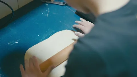 Boy is rolling pizza dough Stock Footage 255886238