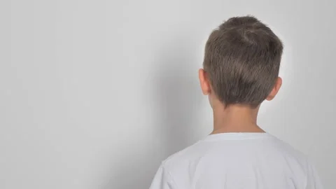 The boy rotates on a white background Video stock 222642486