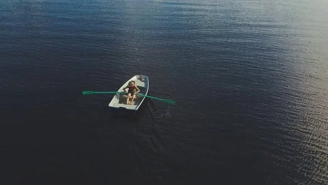 Boy Rowing Boat On Lake Video stock 79497406