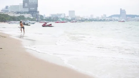 Boy run on the beach Slow Stock Footage 71235205