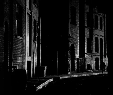 Boy running away and getting caught by police officer, United Kingdom, UK, 1946 Video stock 133378013