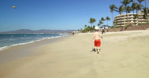 Boy running on the beach.  Stock Footage 102690485