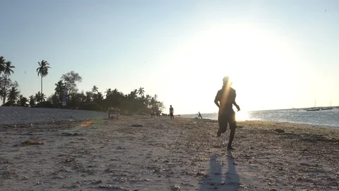 A boy is running on the beach Video stock 105579615